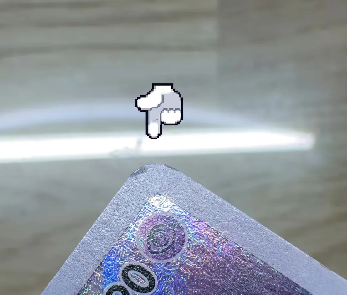 Corner lift: the card's layers separating at the corner